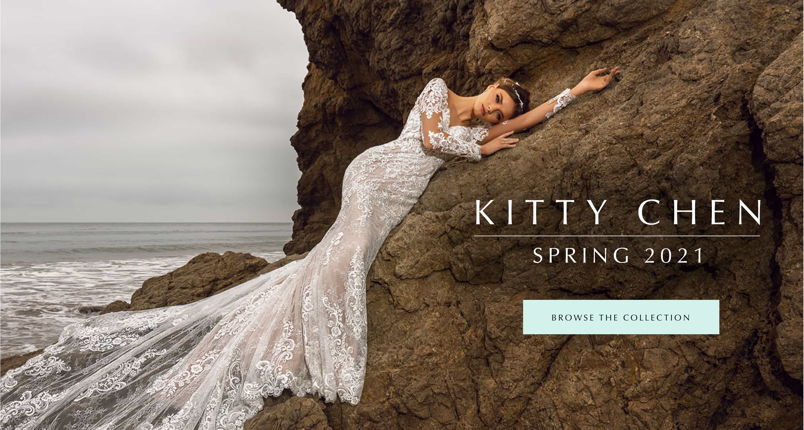 Model wearing a lace Kitty Chen wedding gown at the beach